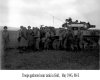 Troops gathered near tank in field, 88-E