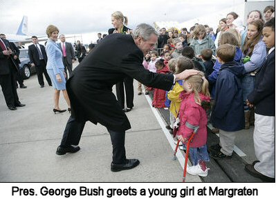 Pres. George Bush greets a young girl at Margraten