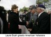 Laura Bush shakes hands with a veteran