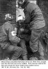 Medics treat wounded infantryman Pvt Pollitt near Linne, Holland, 58-C