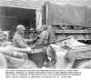 2 Mar 45 - Hot food loaded from mess truck to jeep
