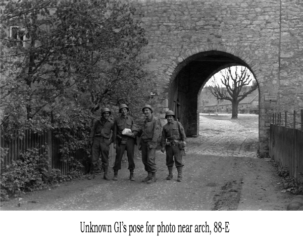 Unknown GI's pose for photo near arch, 88-E