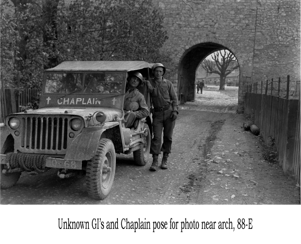 Unknown GI and Chaplain pose for photo near arch, 88-E