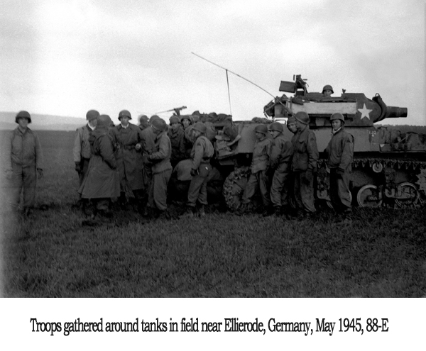 Troops gathered around tanks in field near Ellierode, Germany, May 1945, 88-E