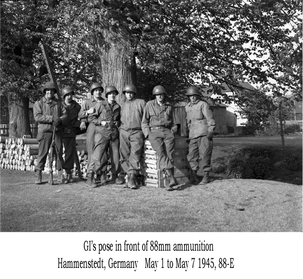 GI's pose in front of 88mm ammunition, Hammenstedt, Germany May 1 to May 7, 1945, 88-E