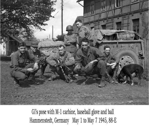 GI's pose with M-1 carbine, baseball glove and ball, Hammenstedt, Germany, May 1 to May 7, 1945