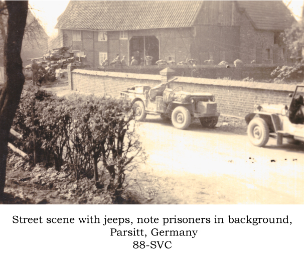 Street scene with jeeps and prisoners, Parsitt, Germany, 88-Svc